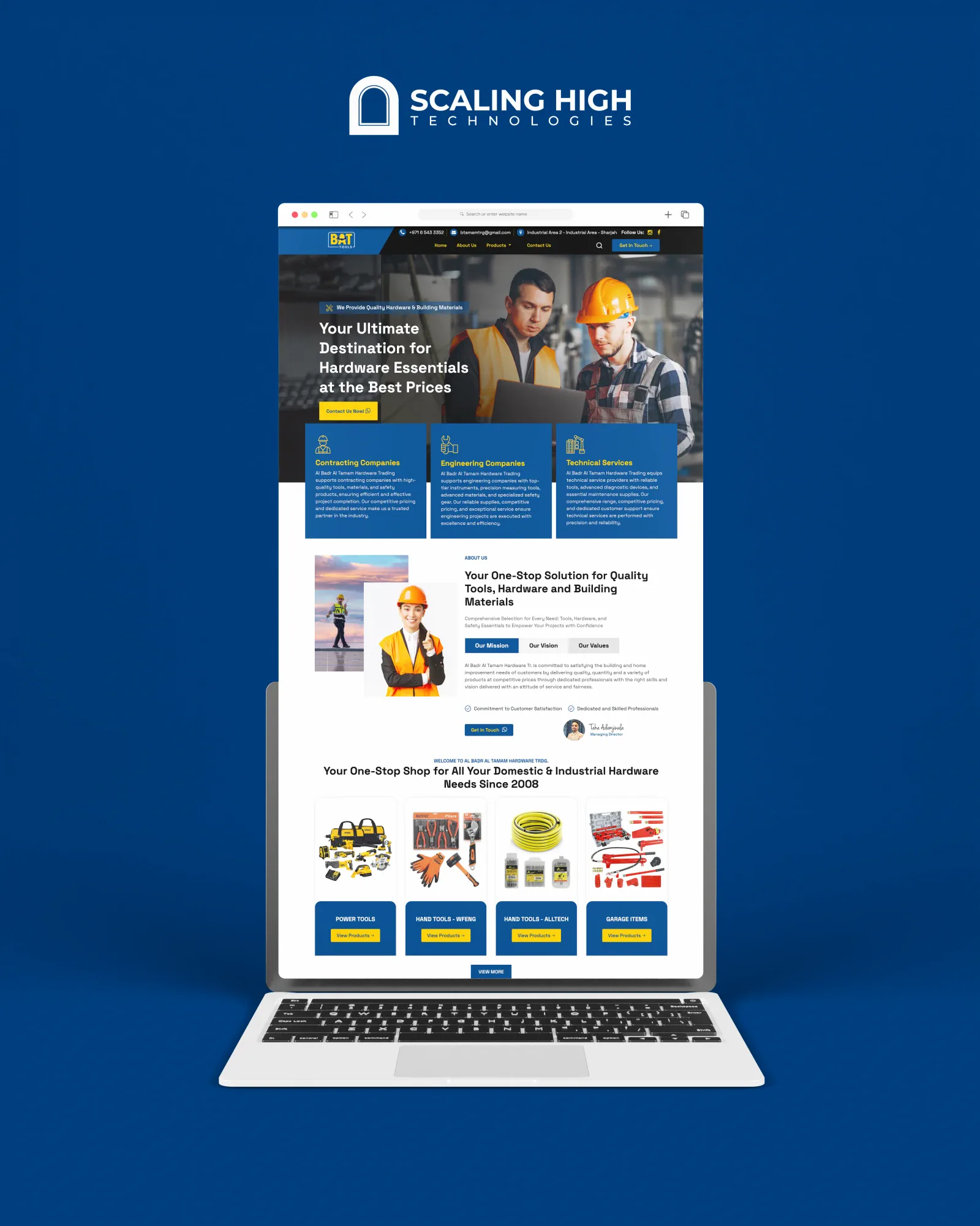 Homepage of a hardware and power tools retailer's website shown on a laptop, with a hero image of workers and a hardware essentials tagline